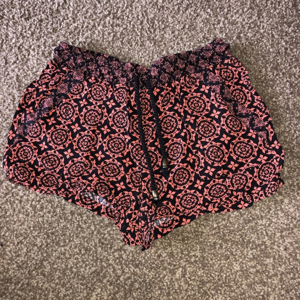 coral and black shorts